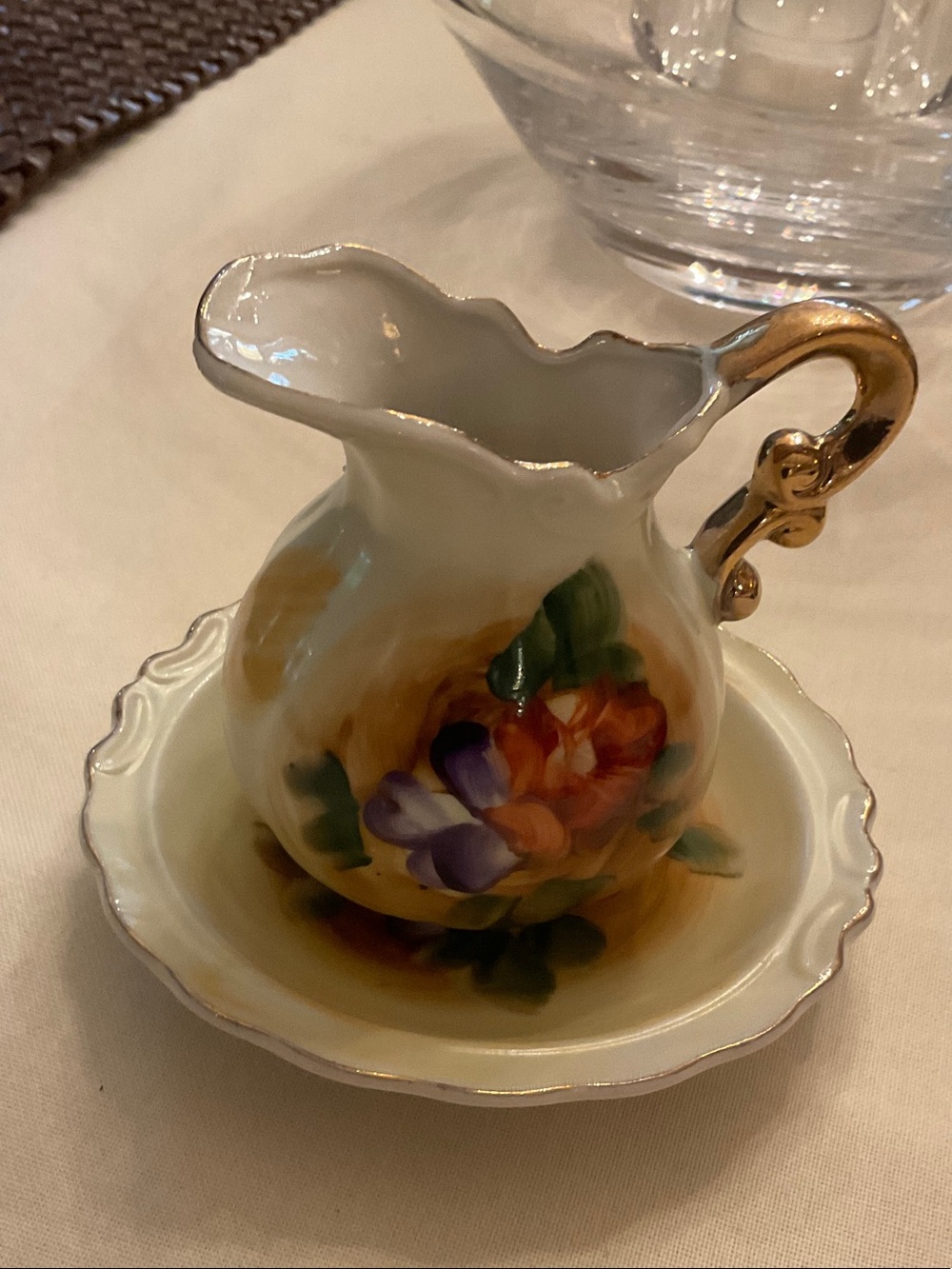 Vintage, hand painted china pitcher & saucer!  Condition is vintage mint!